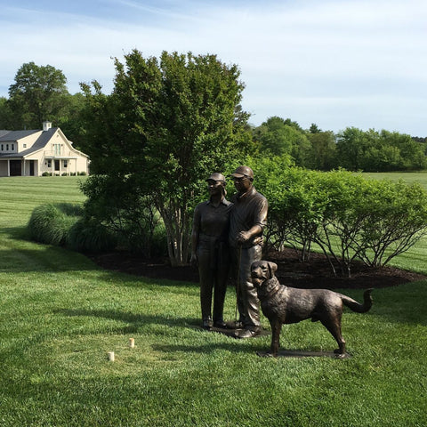 Golfing Couple with Pet Chesapeake Bay Retriever