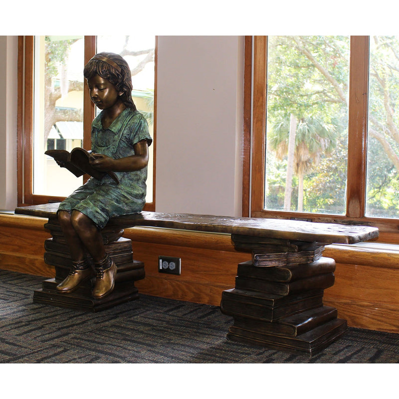 Bronze Statue of a Girl Reading a Book on a Bench