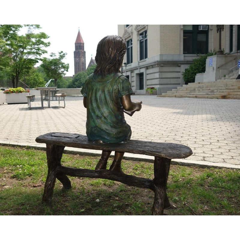 Bronze Statue of a Girl Reading a Book on a Bench