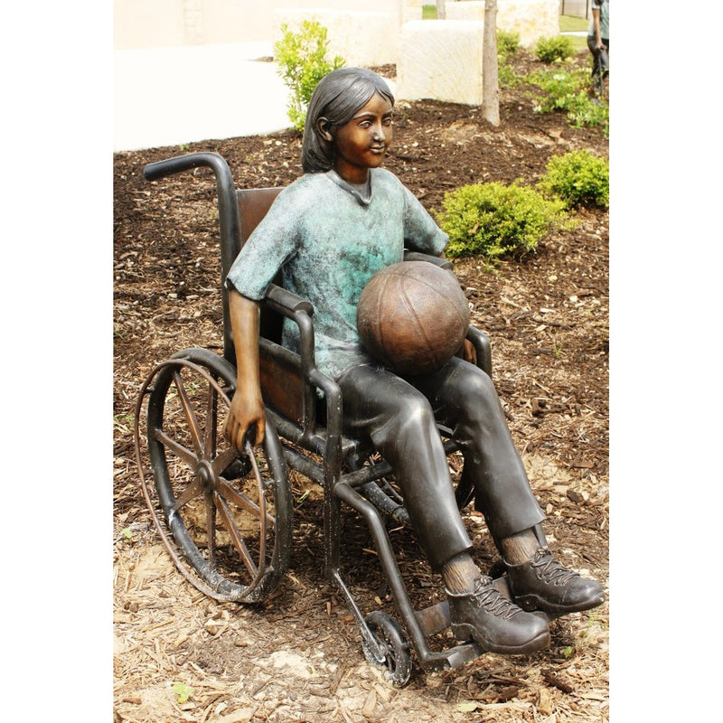 Bronze Statue of a Girl with Special Needs in a Wheelchair Holding a Ball