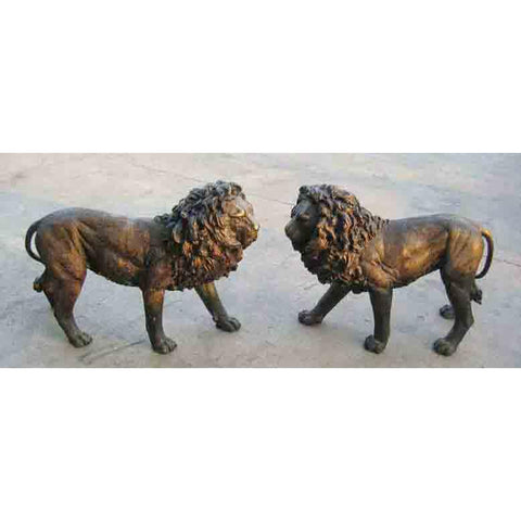 Pair of Walking Lion Statues