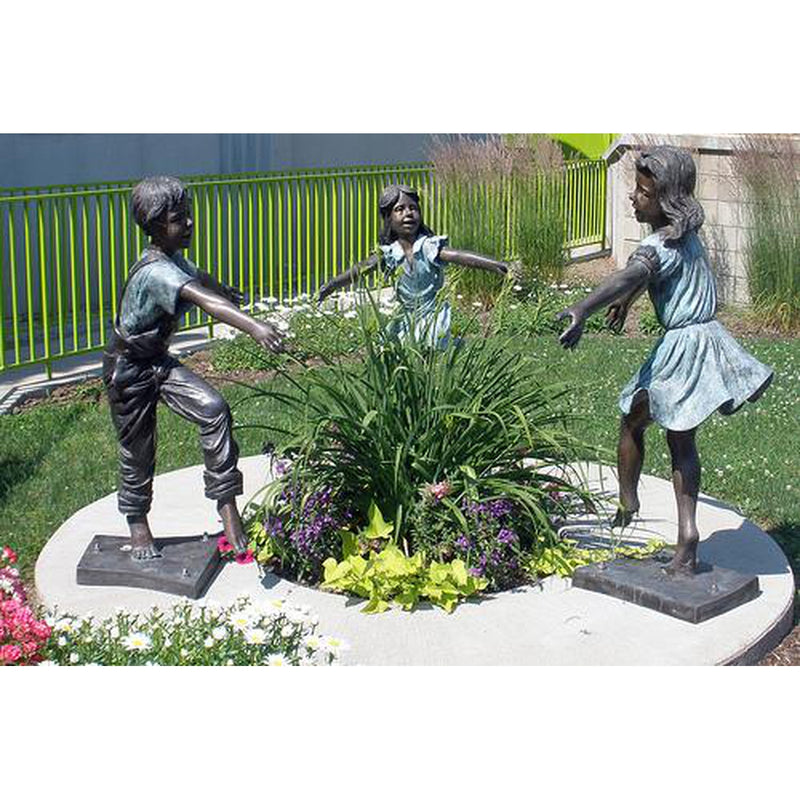 Bronze Statue of a Boy and Two Girls Holding Hands and Dancing in a Circle