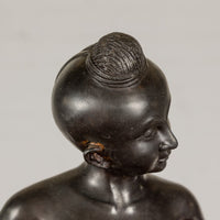 Young Boy Bronze Tabletop Statuette in Dark Patina