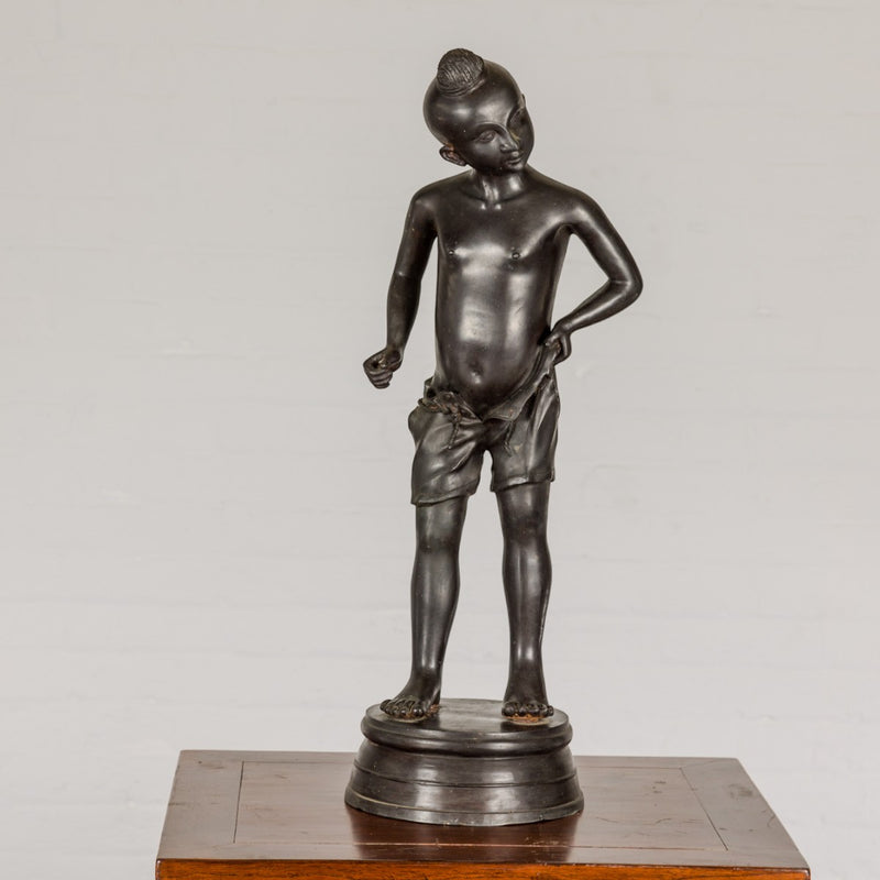Young Boy Bronze Tabletop Statuette in Dark Patina