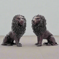 Sitting Lions with Turned Heads