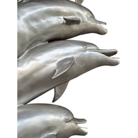 Four Swimming Dolphins