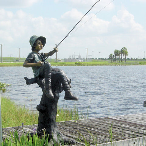 Bronze Statue of a Boy Fishing With His Dog