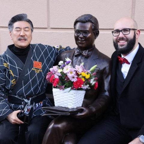 Man Sitting on Park Bench with Newspaper, Michael Yun