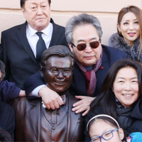 Man Sitting on Park Bench with Newspaper, Michael Yun