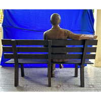 Man Sitting on Park Bench with Newspaper, Michael Yun