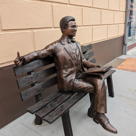 Man Sitting on Park Bench with Newspaper, Michael Yun