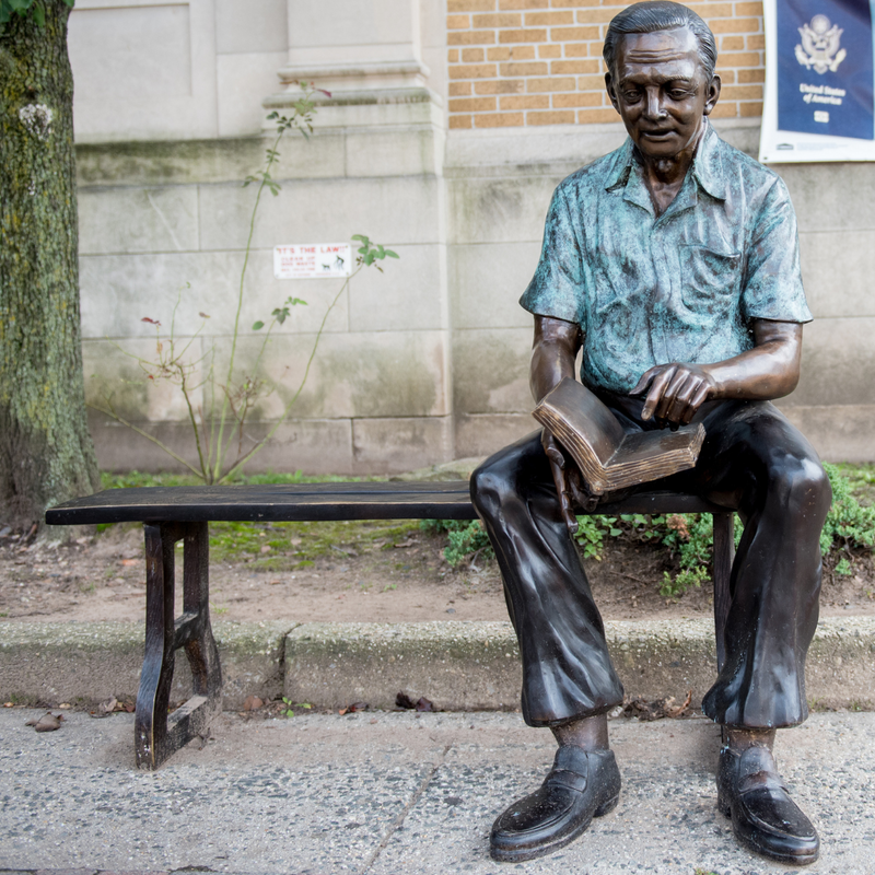 Bronze Grandfather Statue Reading on Bronze Bench