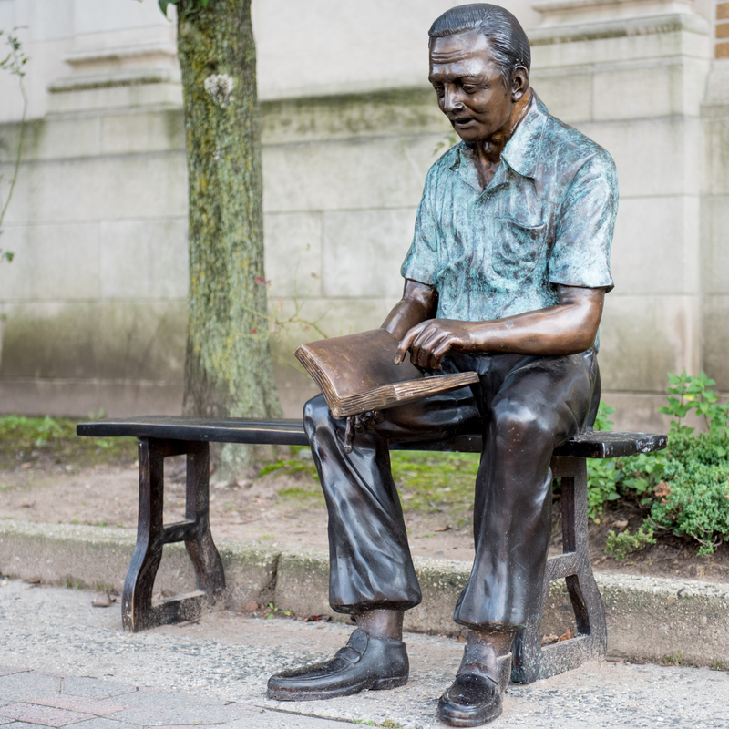 Bronze Grandfather Statue Reading on Bronze Bench