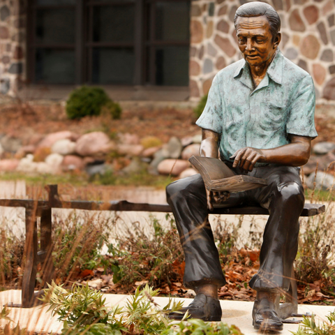 Bronze Grandfather Statue Reading on Bronze Bench