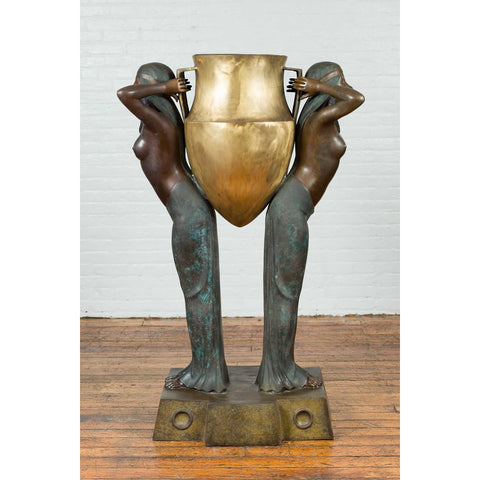 Bronze Egyptian Style Planter Depicting Two Maiden Carrying a Large Urn