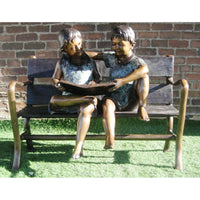 boy and girl reading a book bronze sculpture for library