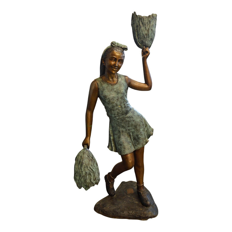 bronze statue of a girl cheeleading