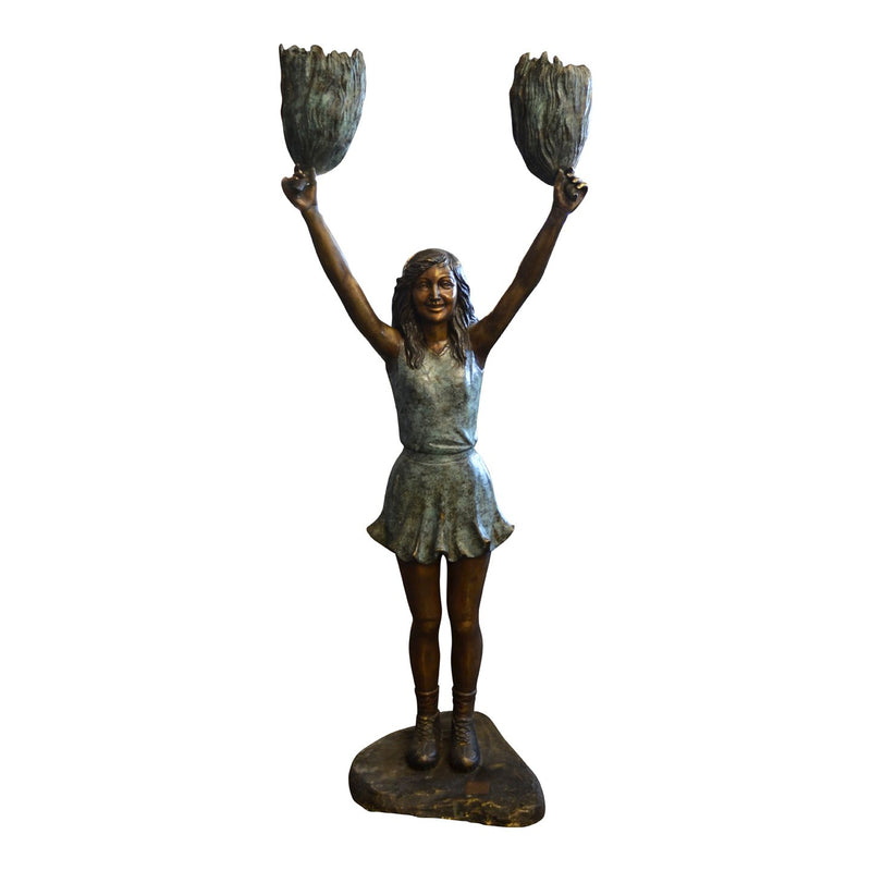 bronze statue of a girl cheerleading football statue