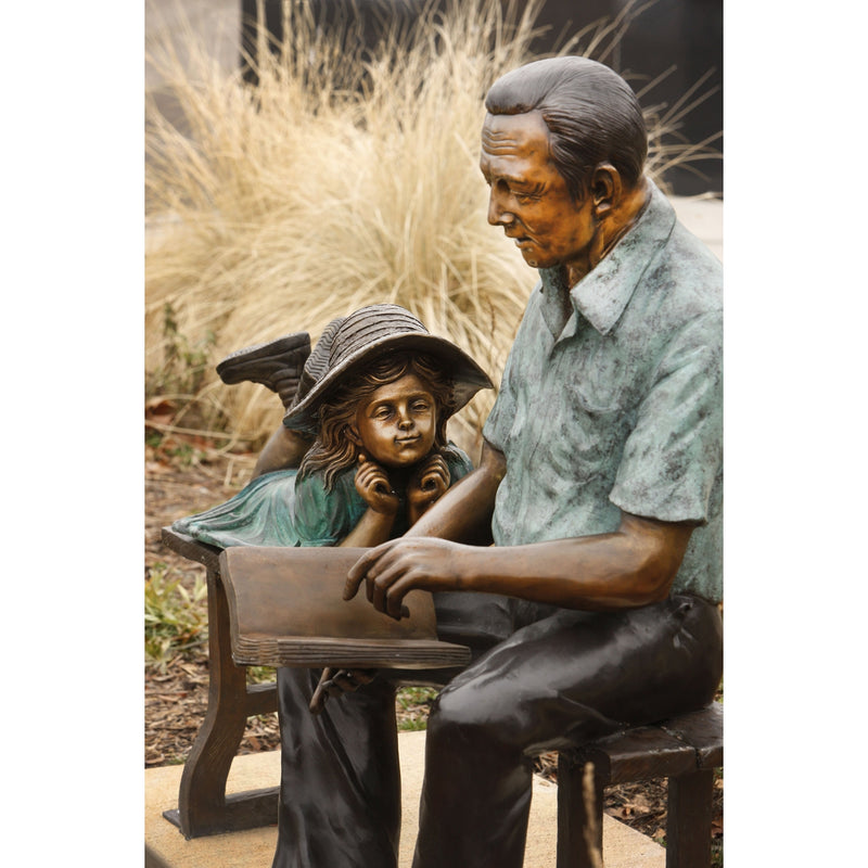 Grandfather and Granddaughter Bronze Statue on Bench Reading