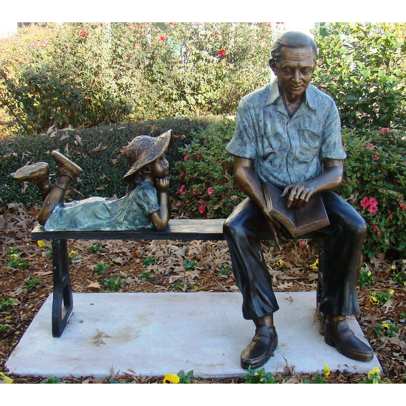 Bronze Statue of a Grandfather Man on Bench Reading a Book to a Girl