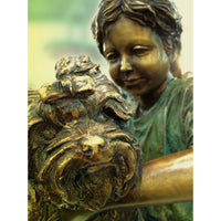 Boy holding puppy dog bronze statue