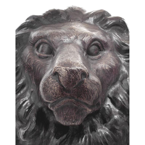 Pair of Sitting Lion Statues with Head Turned