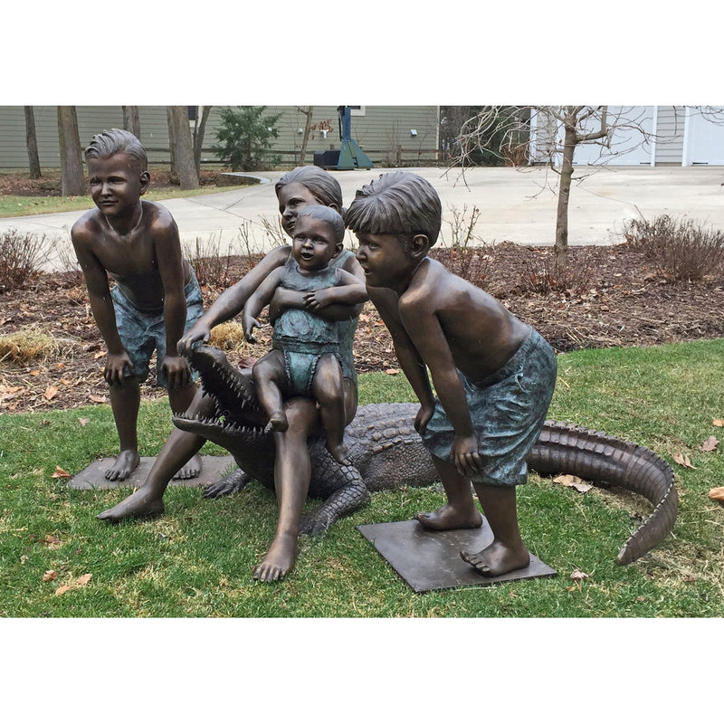 Custom bronze alligator and children statue