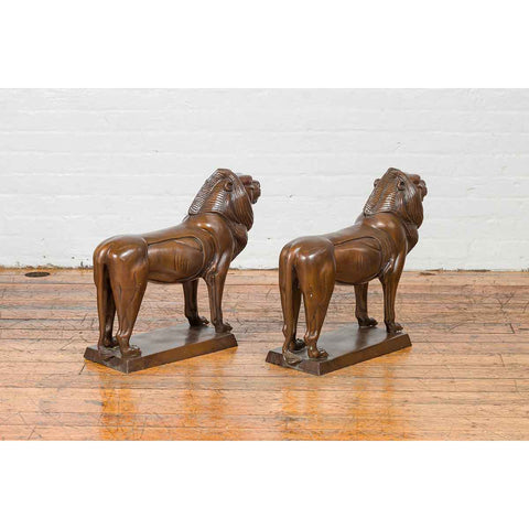 Pair of Bronze Lion Sculptures on Bases with Dark Patina