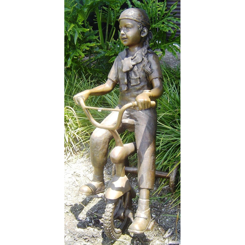 Girl Riding Tricycle Bronze Statue