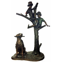 bronze statue of two boys playing in tree with dog