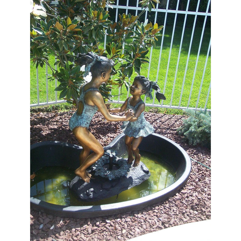 Bronze Statue of  Two Girls in SwimSuits Playing Fountain