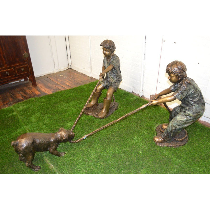 Bronze Statue of Children Playing with a Dog