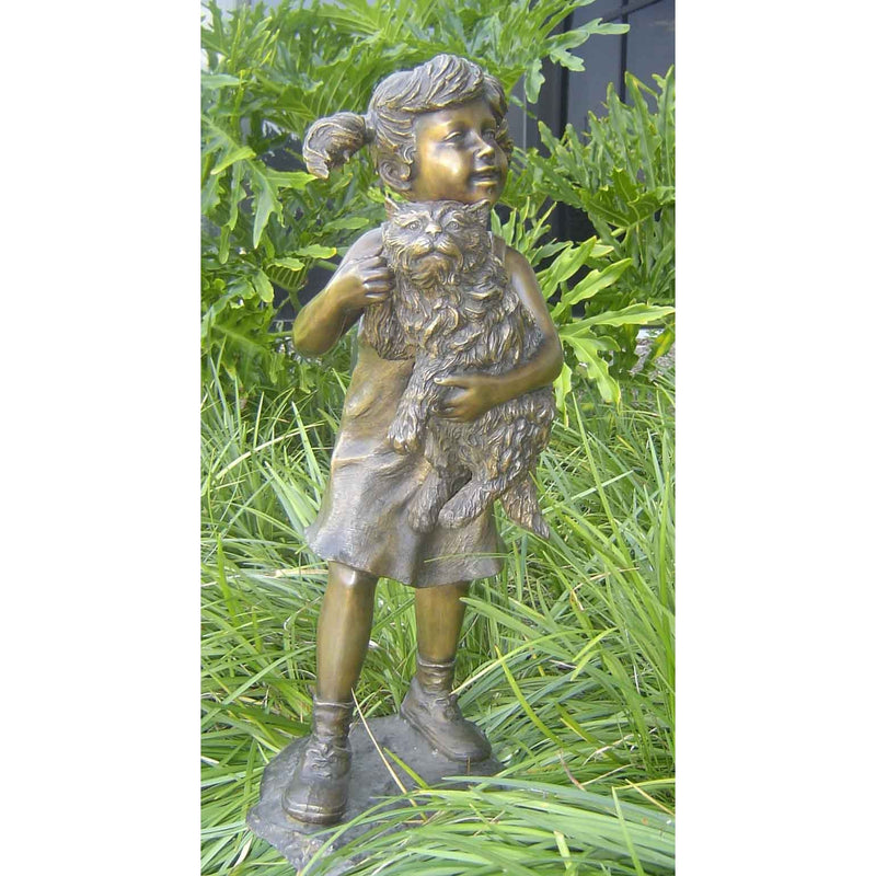 Bronze cat statue with little girl