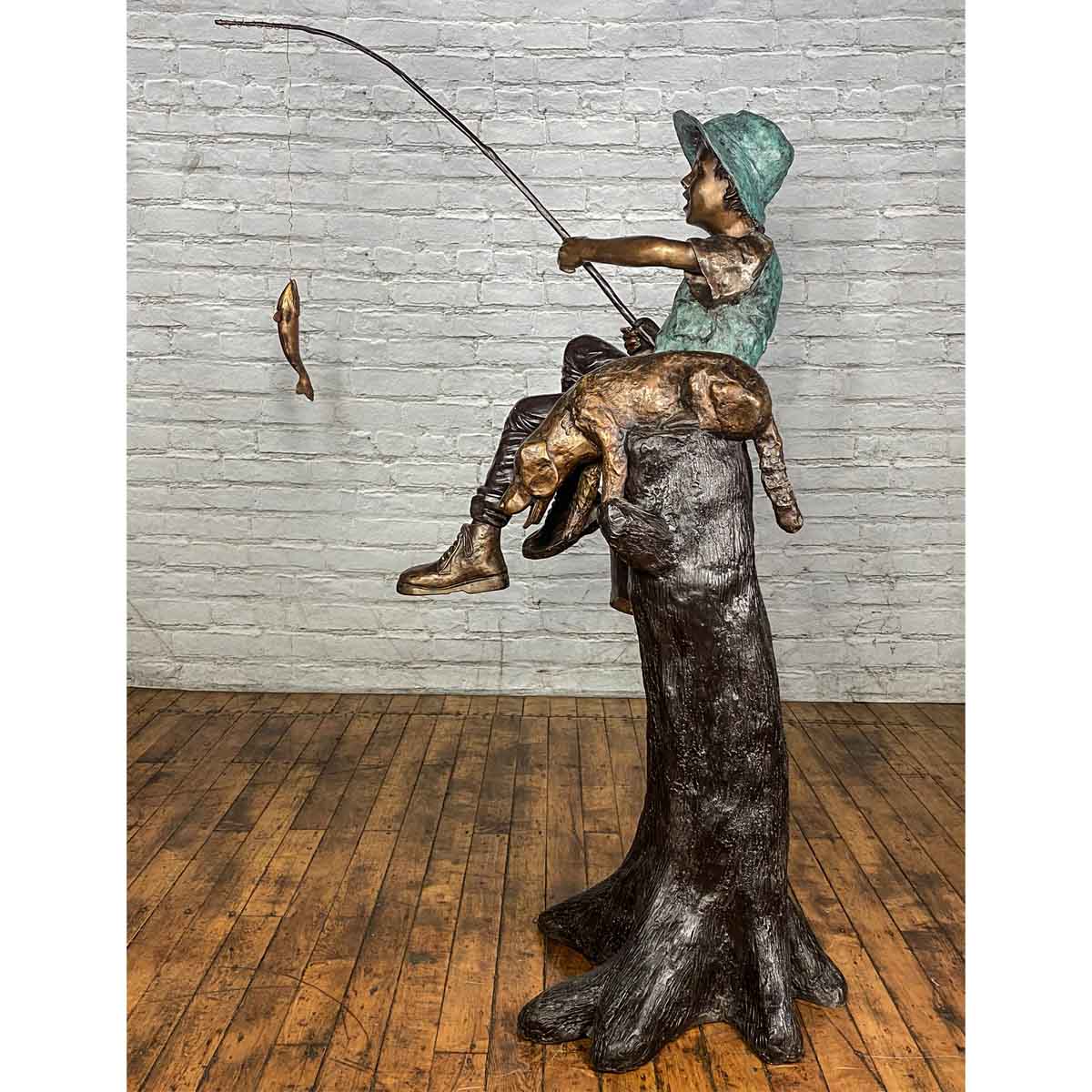 Bronze Statue of a Boy Fishing With His Dog