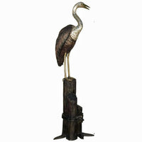 Crane Perched on Tall Piling